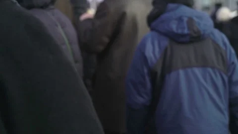 Concept of the crowd unrecognizable people walking on the street in winter or Stock Footage 78767275
