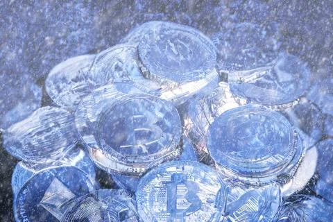 Concept for Crypto winter, Bitcoin in blue ice. Bitcoin price crash Stock Photos