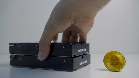 Concept of cryptocurrency mining. Mining cryptocurrency coins using hard disk Vídeos de archivo 154022162
