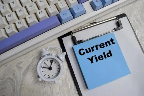 Concept of current yield write on sticky notes isolated on Wooden Table. Stock Photos