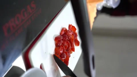 Concept of cutting strawberries with a knife in the kitchen Stock Footage 230350510