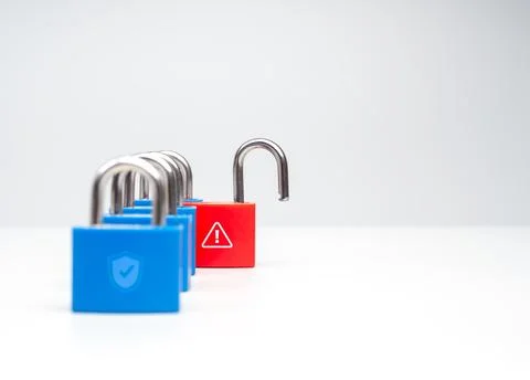 Concept of cybersecurity risk and data breach with a row of locked blue pad.. Stock Photos