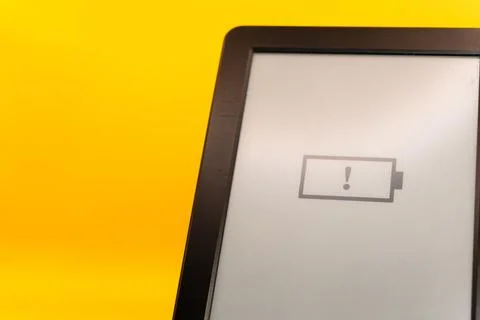 Concept A dead battery on a modern device, a device without a charger, a dead Stock Photos