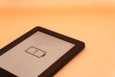 Concept A dead battery on a modern device, a device without a charger on a Stock Photos
