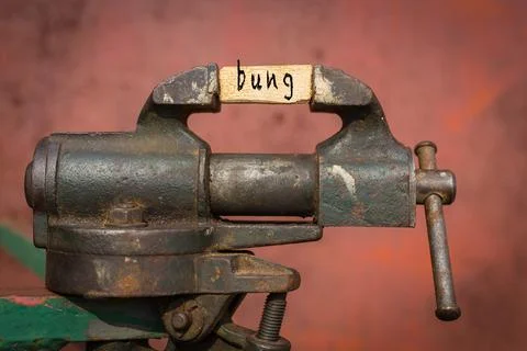 Concept of dealing with problem. Vice grip tool squeezing a plank with the wo Stock Illustration