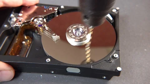 Concept of deleting big data by drilling a hole into the harddisk Stock Footage 107880558