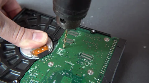 Concept of deleting big data by drilling a hole into the harddisk Stock Footage 107882685