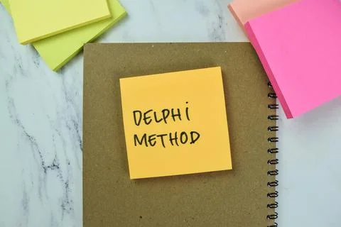 Concept of Delphi Method write on sticky notes isolated on Wooden Table. 写真素材