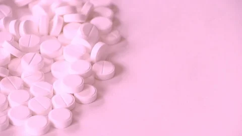 The concept of dependence. Many white pills with red-blue neon light. Stock Footage 112042561