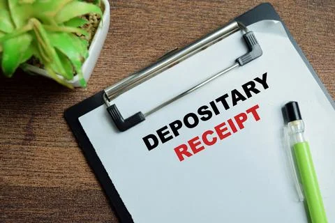 Concept of depositary receipt write on clipboard isolated on Wooden Table. Stock Photos