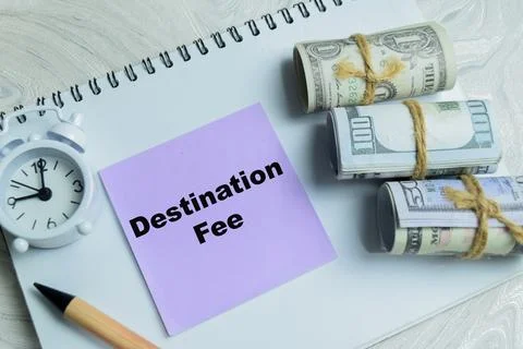 Concept of destination fee write on sticky notes isolated on Wooden Table. 스톡 사진