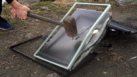 The concept of destruction of technology. Smashing a computer with sledge hammer Stock Footage 92426070