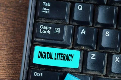 Concept of Digital Literacy write on keyboard isolated on laptop background Stock Photos