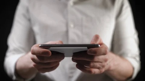 Concept, digital online life and social networks. A businessman in a shirt uses Stock Footage