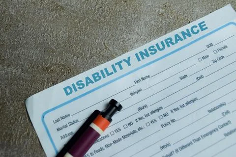 Concept of disability insurance write on application isolated on Wooden Table Stock Photos