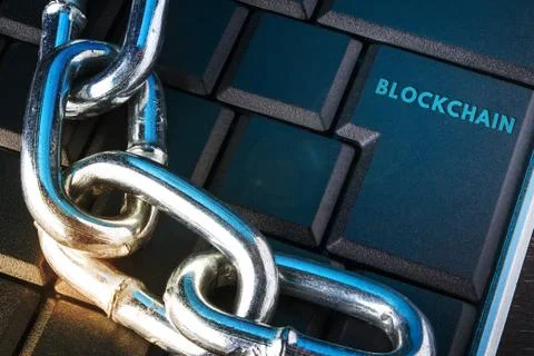 Concept of distribution network technology blockchain. Chain on the keyboard. Stock Photos
