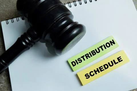 Concept of distribution schedule write on sticky notes and judge gavel Stock Photos