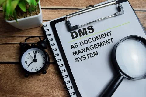 Concept of DMS as Document Management System write on clipboard 스톡 사진