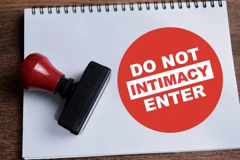 Concept of Do not enter intimacy a red round sign write on book Stock Photos