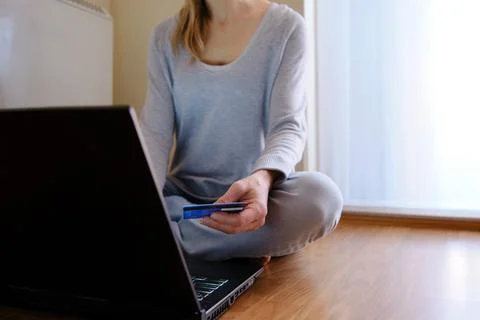 Concept of doing shopping without leaving your house. Woman shopping on-line Stock Photos