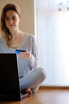 Concept of doing shopping without leaving your house. Woman shopping on-line Stock Photos