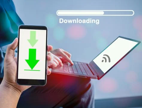 The concept of downloading data using mobile phones and computers. 스톡 사진