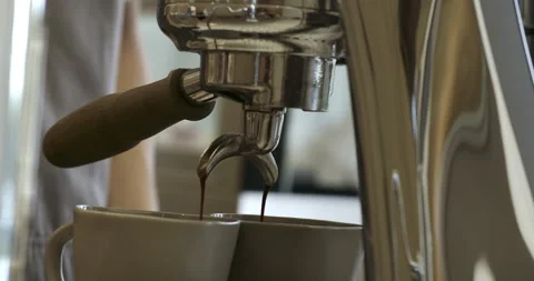 Concept Drinking roasted black coffee in the morning. Pouring coffee stream from Stock Footage 238837715