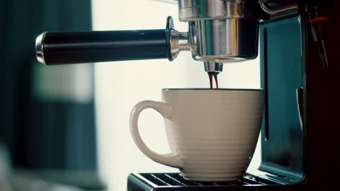 Concept Drinking roasted black coffee in the morning.Pouring coffee stream from Stock Footage 247409368