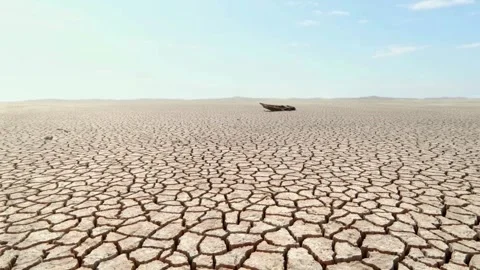 Concept of drought Soil cracked Dry fractured soil drought on lake river sea 스톡 동영상 334030050