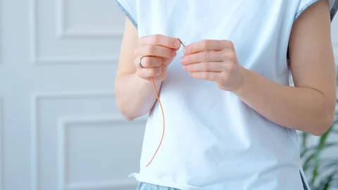 Concept during self-isolation and quarantine. Woman sews a mask Stock Footage 127743640