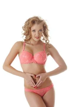 Concept of early pregnancy. Cute model in lingerie Concept of early pregna... Stock Photos