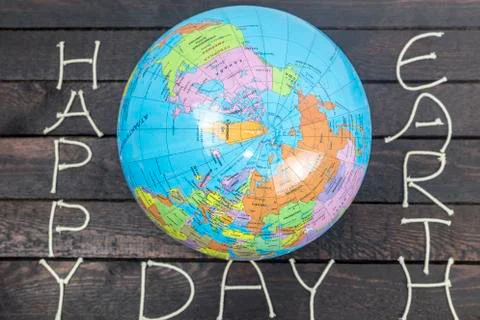 Concept-Earth Day. Globe with the text: Happy Earth Day Stock Photos