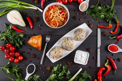 The concept of Eastern festive cuisine. Assorted Uzbek food set, pilaf, samsa Stock Photos