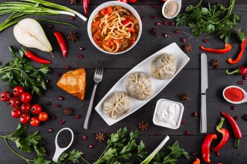 The concept of Eastern festive cuisine. Assorted Uzbek food set, pilaf, samsa Stock Photos