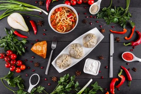 The concept of Eastern festive cuisine. Assorted Uzbek food set, pilaf, samsa Stock Photos