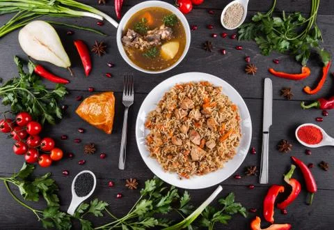 The concept of Eastern festive cuisine. Assorted Uzbek food set, pilaf, samsa Stock Photos