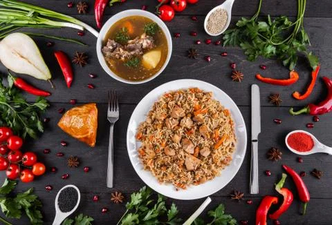 The concept of Eastern festive cuisine. Assorted Uzbek food set, pilaf, samsa Stock-Fotos