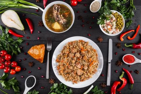 The concept of Eastern festive cuisine. Assorted Uzbek food set, pilaf, samsa Stock-Fotos