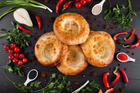 The concept of Eastern festive cuisine. Assorted Uzbek food set, pilaf, samsa Stock Photos