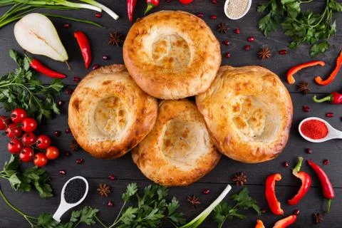 The concept of Eastern festive cuisine. Assorted Uzbek food set, pilaf, samsa Stock Photos