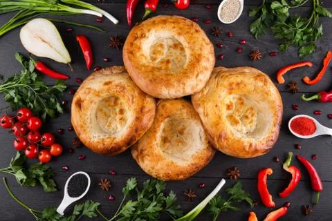 The concept of Eastern festive cuisine. Assorted Uzbek food set, pilaf, samsa Stock Photos