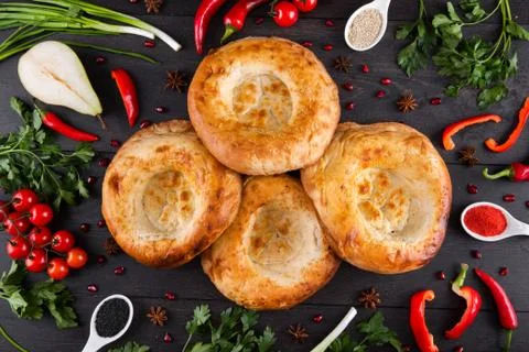The concept of Eastern festive cuisine. Assorted Uzbek food set, pilaf, samsa Stock Photos