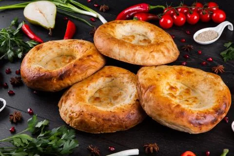 The concept of Eastern festive cuisine. Assorted Uzbek food set, pilaf, samsa Stock Photos