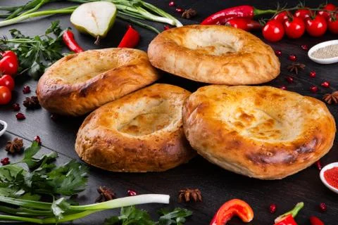The concept of Eastern festive cuisine. Assorted Uzbek food set, pilaf, samsa Stock Photos