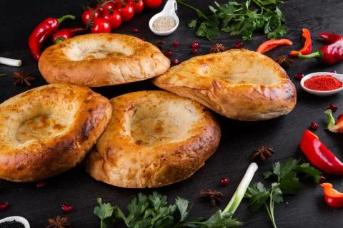 The concept of Eastern festive cuisine. Assorted Uzbek food set, pilaf, samsa Stock Photos
