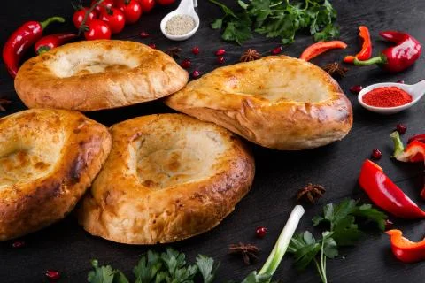 The concept of Eastern festive cuisine. Assorted Uzbek food set, pilaf, samsa Stock Photos