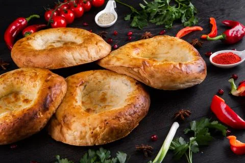 The concept of Eastern festive cuisine. Assorted Uzbek food set, pilaf, samsa Stock Photos