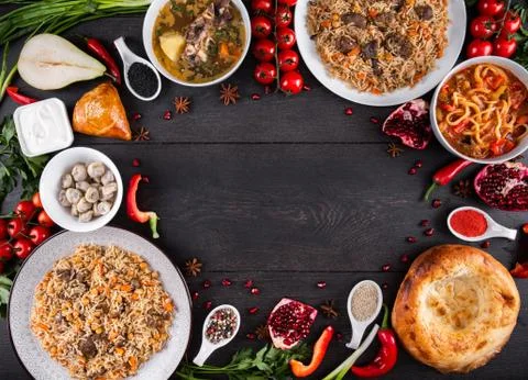 The concept of Eastern festive cuisine. Assorted Uzbek food set, pilaf, samsa Stock Photos