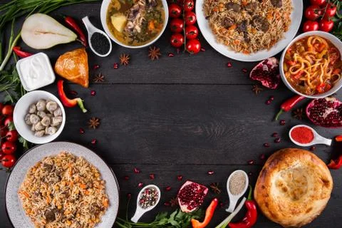 The concept of Eastern festive cuisine. Assorted Uzbek food set, pilaf, samsa Stock Photos
