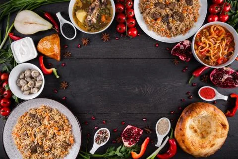The concept of Eastern festive cuisine. Assorted Uzbek food set, pilaf, samsa Stock Photos